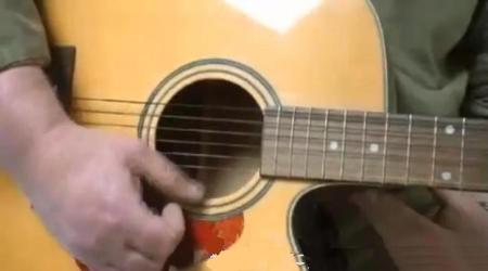how to strum a guitar
