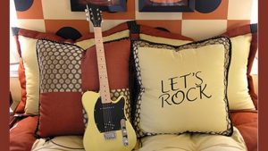 guitar alongside lets rock pillow