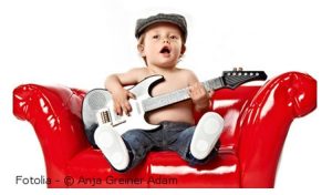 toddler playing guitar